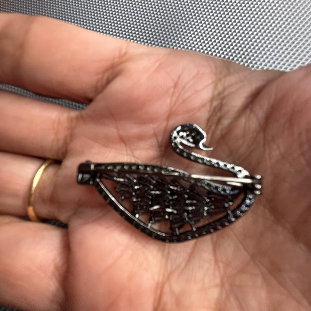 Green crystal swan brooch with lavender stone detailing back view