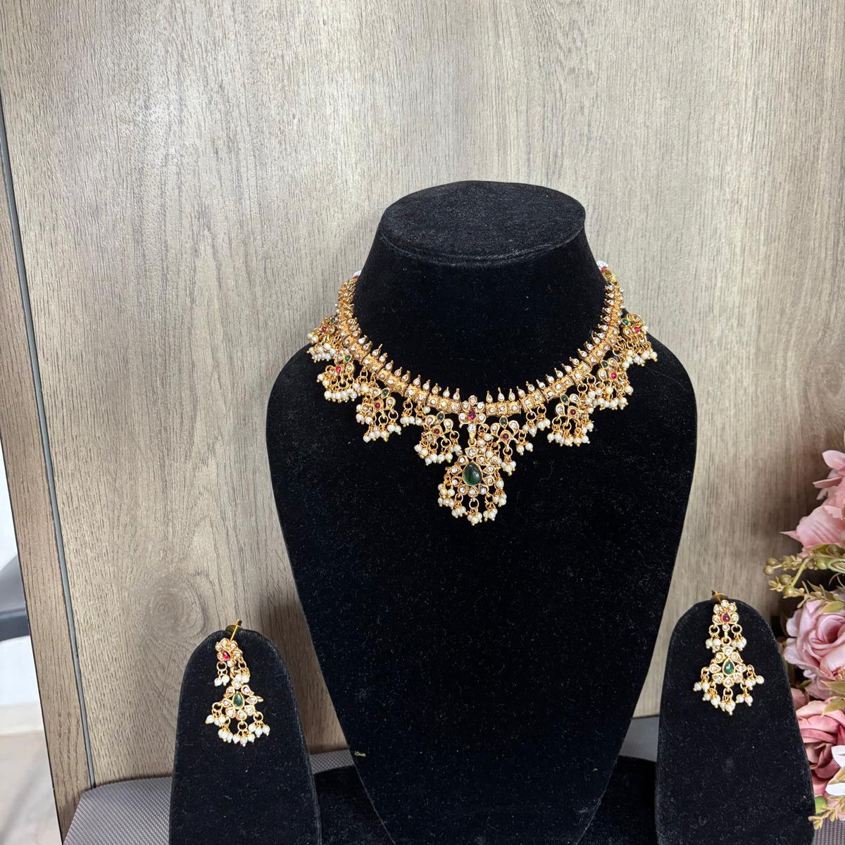 Traditional Gold-tone diamond style necklace set with green centre stone, ruby accents and pearls cluster