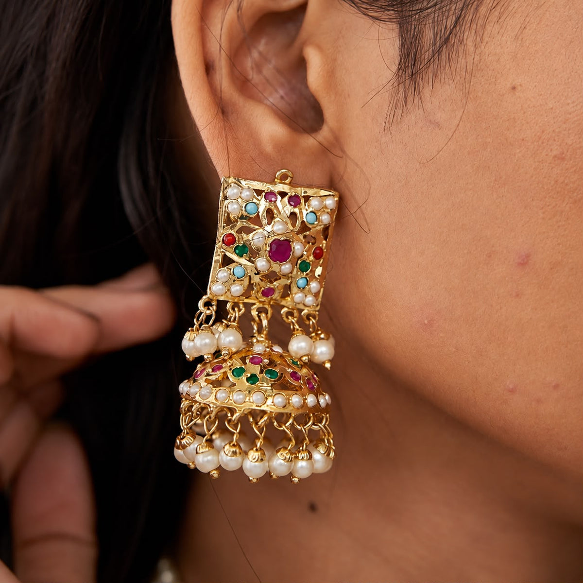 women wearing matching jhumka earrings of the jadau necklace set