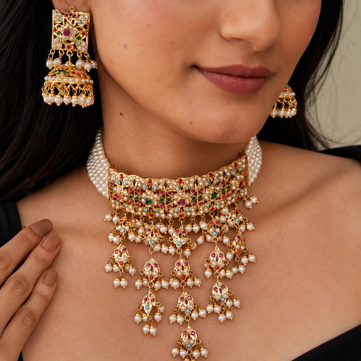 women wearing jadau necklace set with pearl drops and jhaalar with matching jhumka earrings