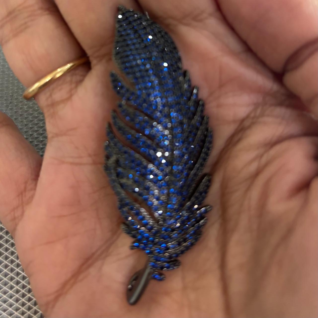 Luxury midnight blue crystal feather brooch with black rhodium finish for saree blazer coat dress and scarf styling by Bebaak Jewels