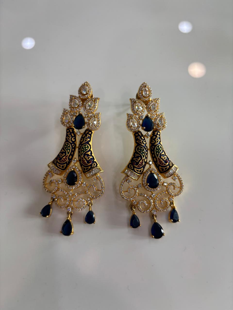 Pair of AD chandelier cocktail earrings with blue stones