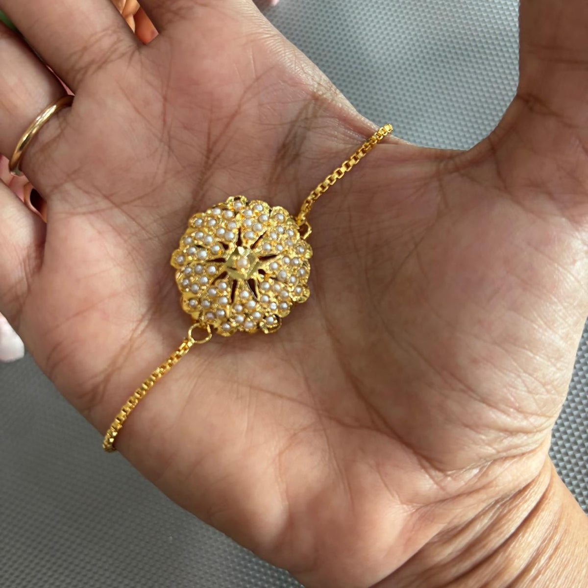 Pearl jadau bracelet rakhi in gold tone only at Bebaak Jewels
