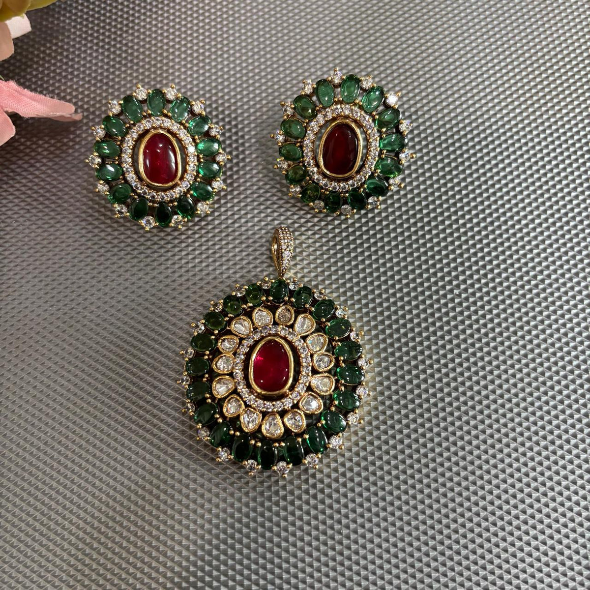 Traditional style Gold tone pendant set with polki kundan , ruby red and emerald green stones