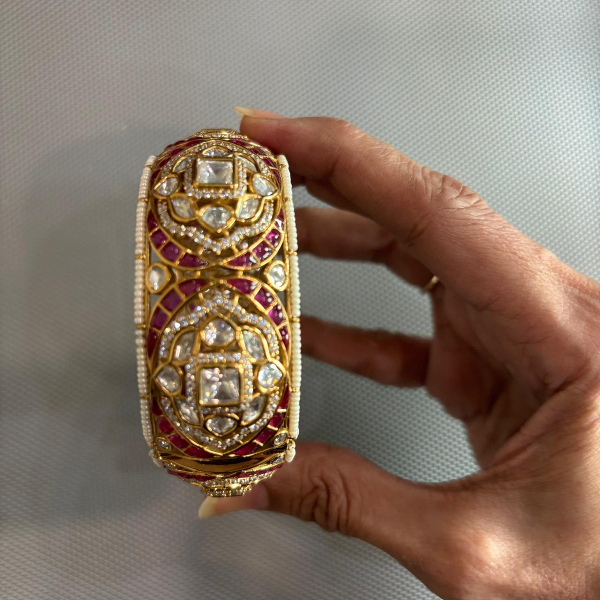 Openable Gold tone moissanite Polki kada with ruby detailing , pearls and uncut diamonds