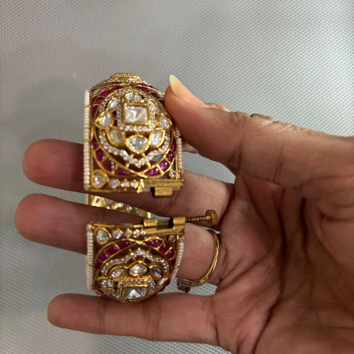 Opened Gold tone moissanite Polki kada with ruby detailing , pearls and uncut diamonds