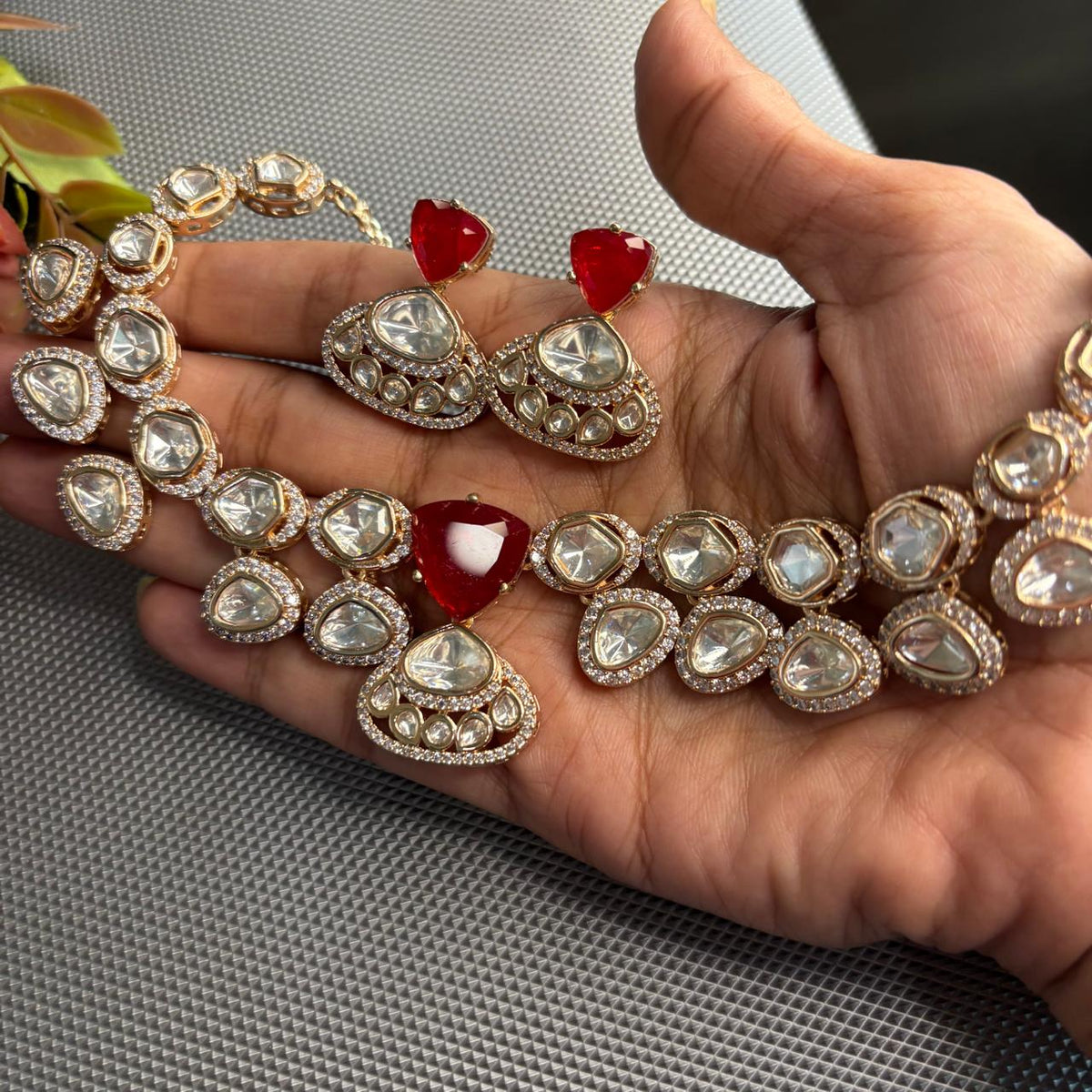 Statement kundan necklace set with ruby centre stone and kundan surrounded by american diamonds and matching earrings