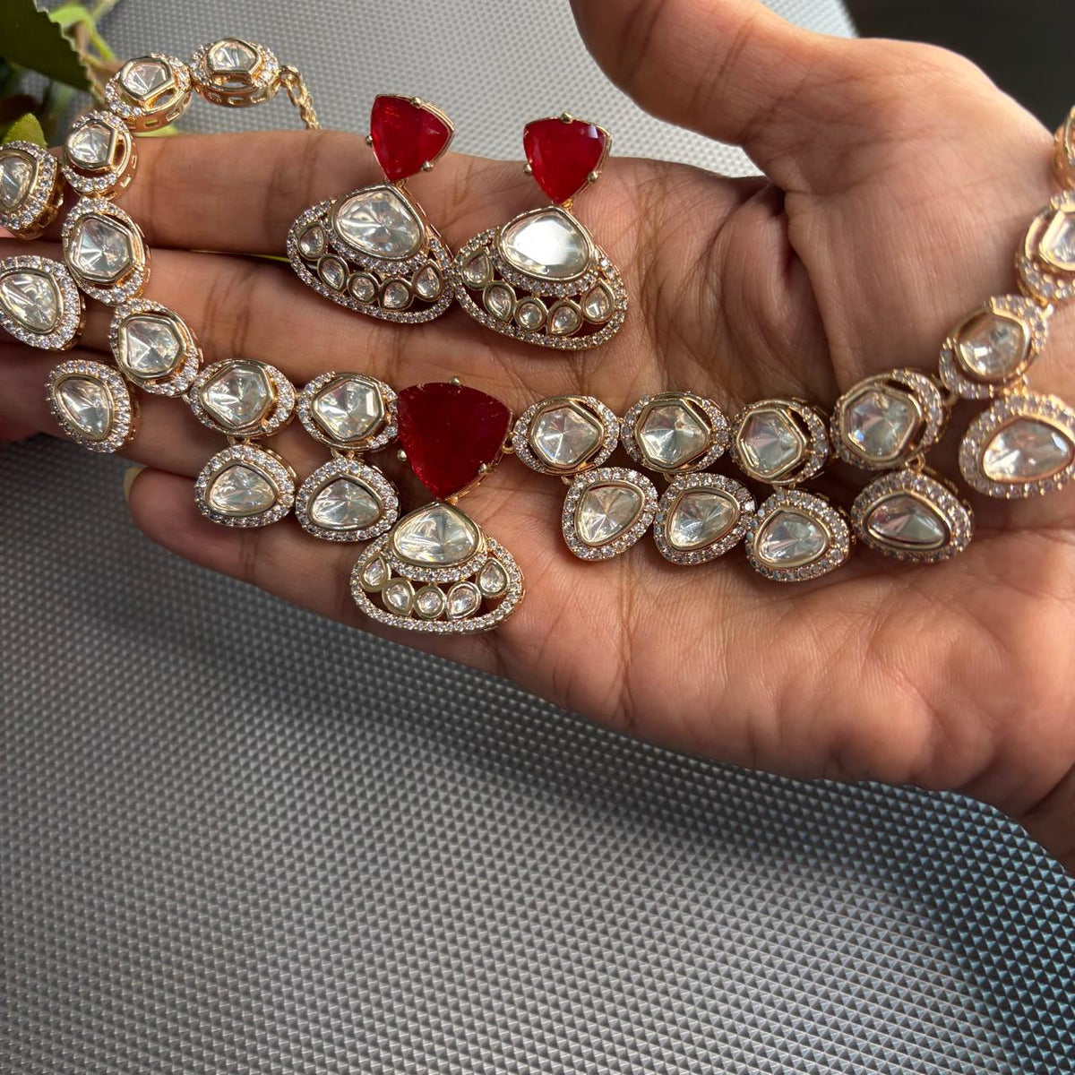 Statement kundan necklace set with ruby centre stone and kundan surrounded by american diamonds