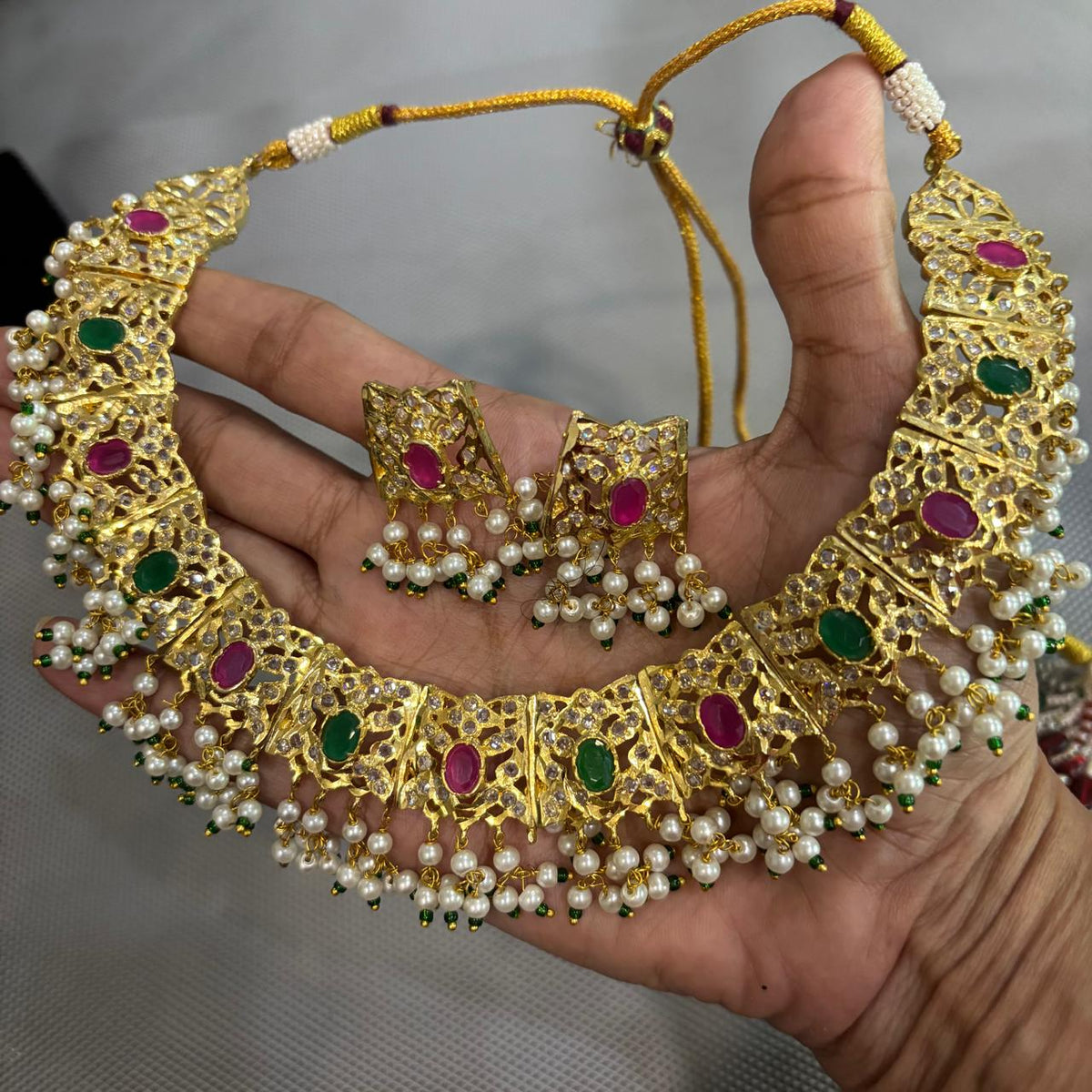 Gold plated jadau necklace set with emerald & ruby and stud earrings