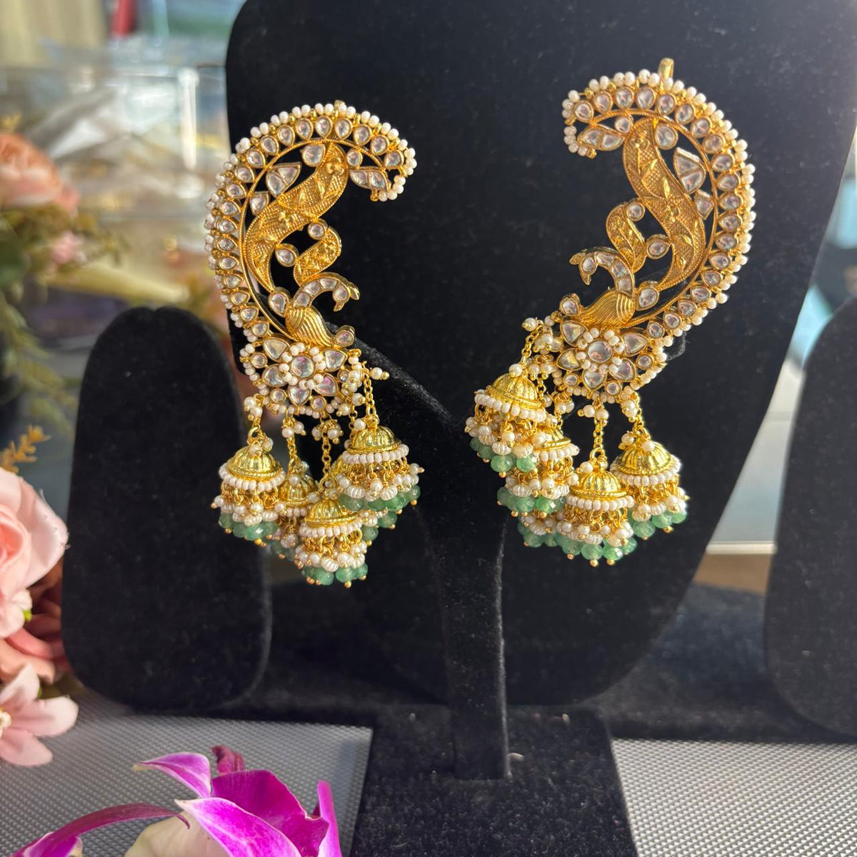 Light green Jadau Kundan peacock ear cuff earrings with dangling jhumkas