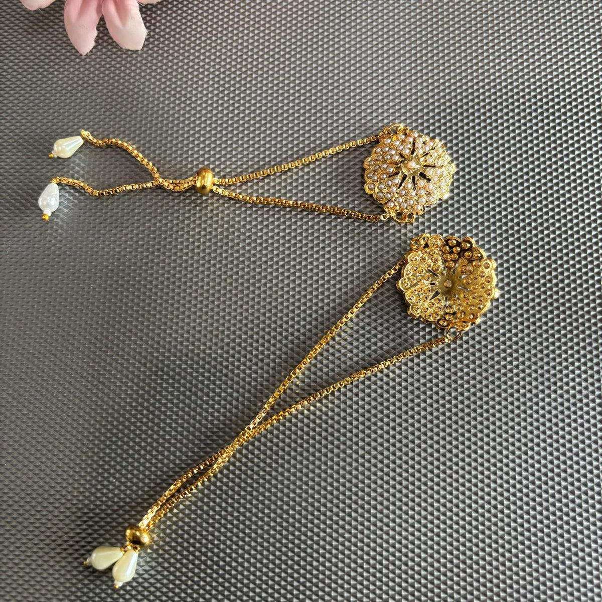 Pearl jadau bracelet rakhi in gold tone