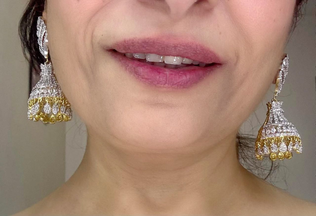 american diamond jhumka earrings in gold plating