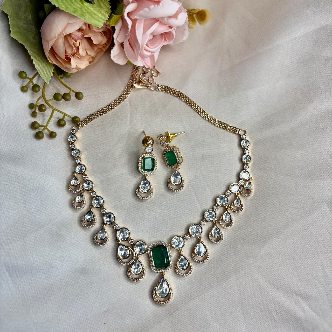 Elegant emerald Kundan and  American Diamond necklace set with matching earrings in premium gold finish for party wear, wedding guest and festive occasions.