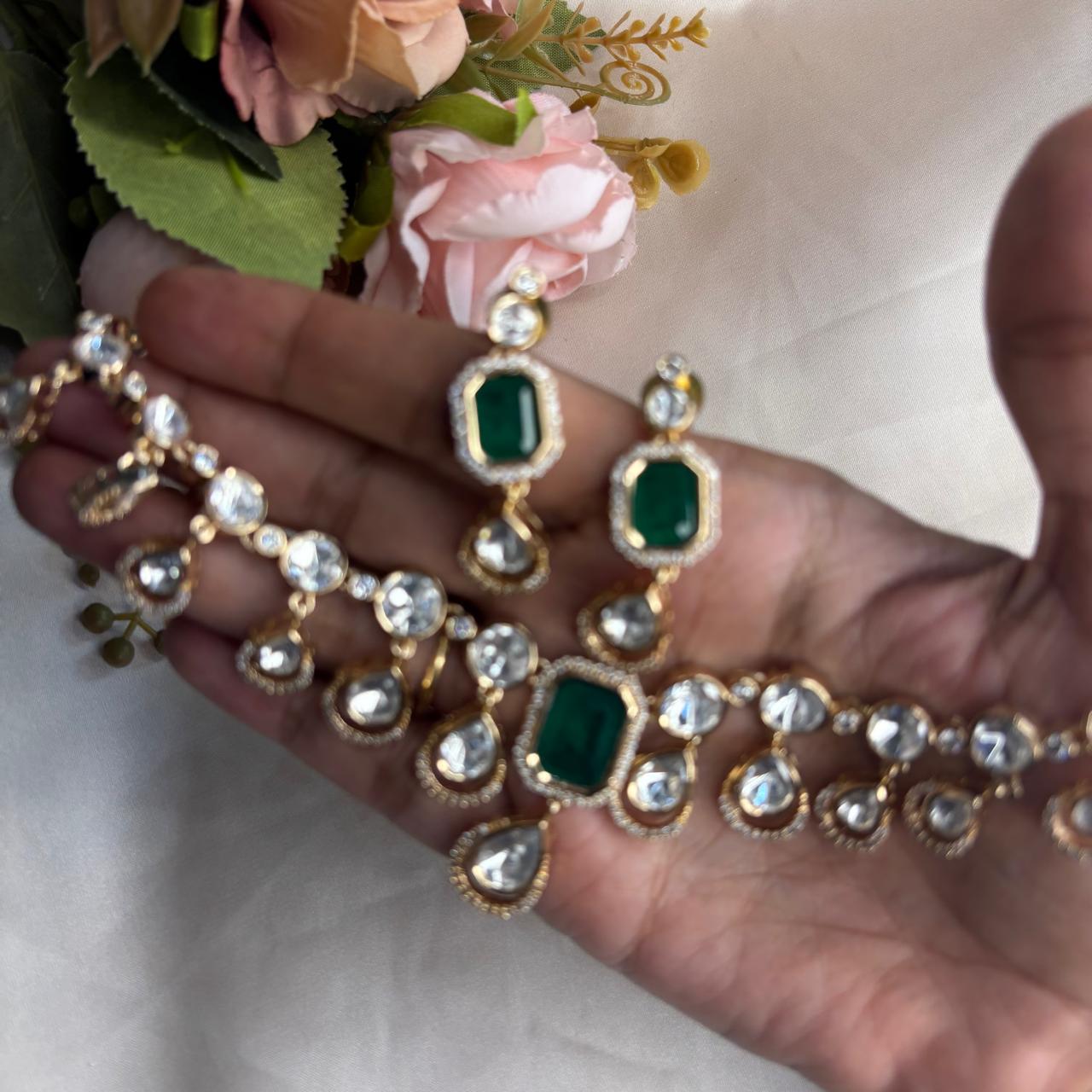 Elegant emerald Kundan and  American Diamond necklace set with matching earrings in premium gold finish for party wear, wedding guest and festive occasions.