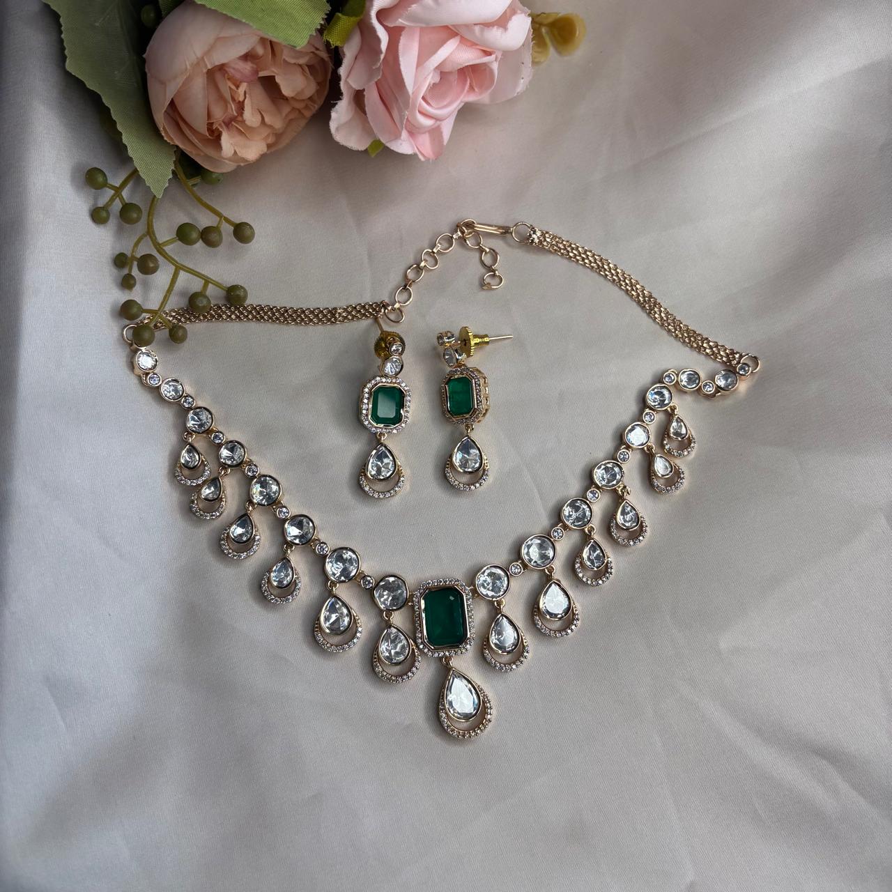 Elegant emerald Kundan and  American Diamond necklace set with matching earrings in premium gold finish for party wear, wedding guest and festive occasions.