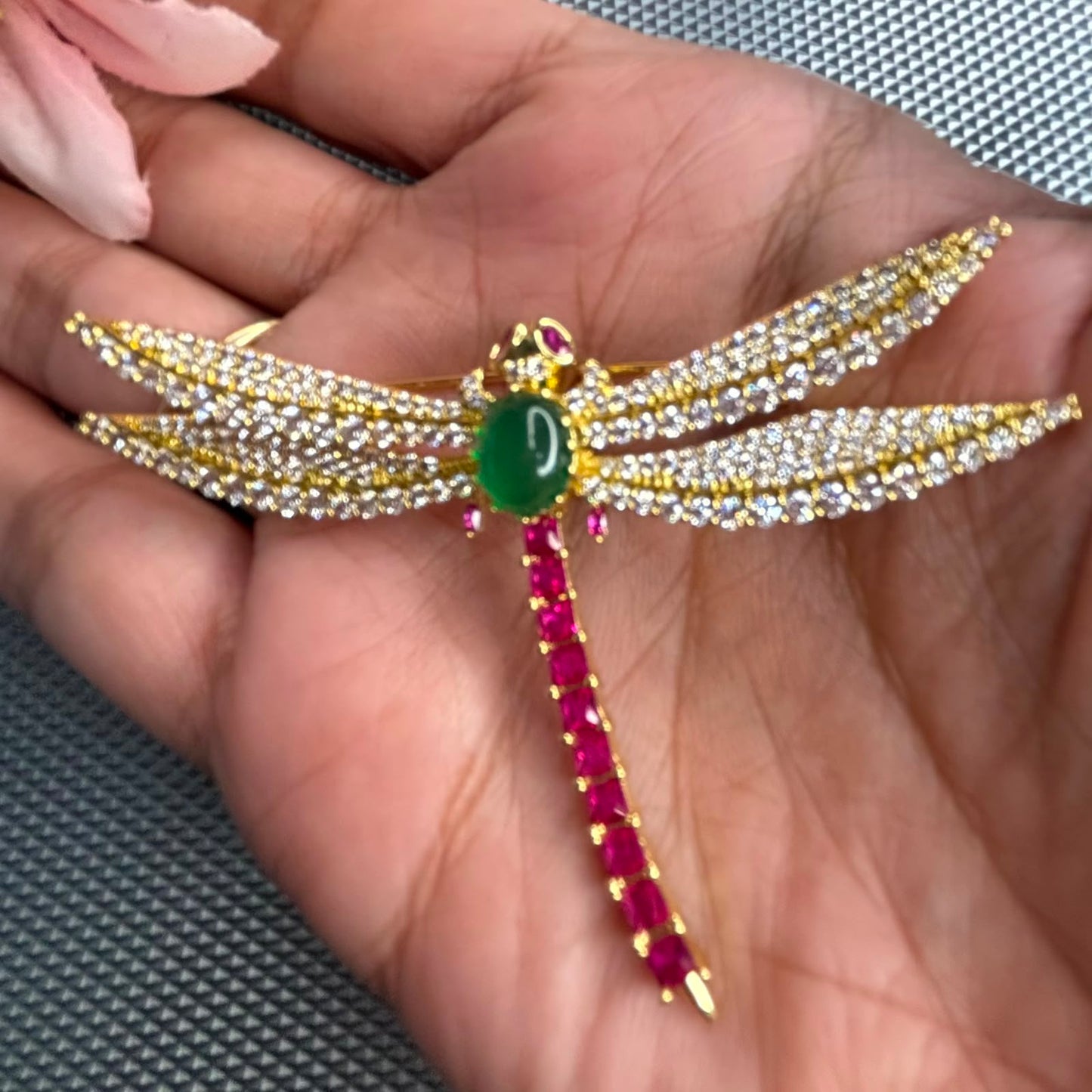 Luxury dragonfly brooch pin with green stone, ruby tail and cubic zirconia wings in gold finish for saree blazer sherwani styling