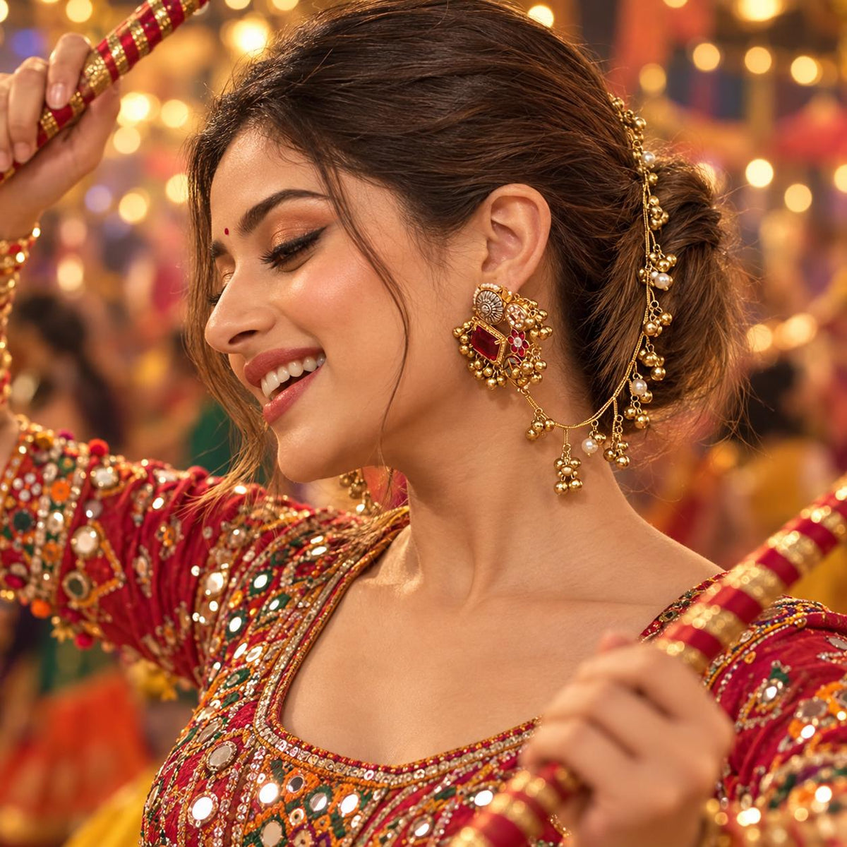 A close-up view of a woman wearing a gold-toned traditional  kashmiri Indian earrings with a matching earchain sahara  hair chain .The earring features a large red stone, a silver-toned circular motif, and small pearl-like beads.