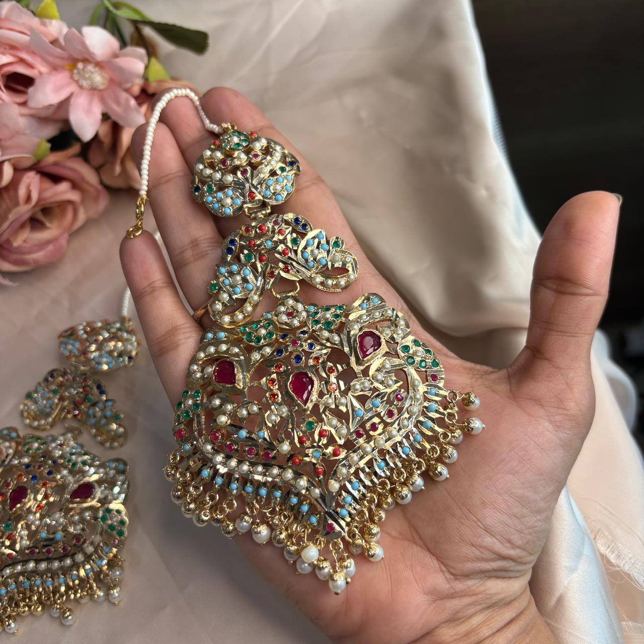 Handcrafted gold plated Jadau ear climber Kannauti earrings with pearl drops and multicolour stones by Bebaak Jewels.