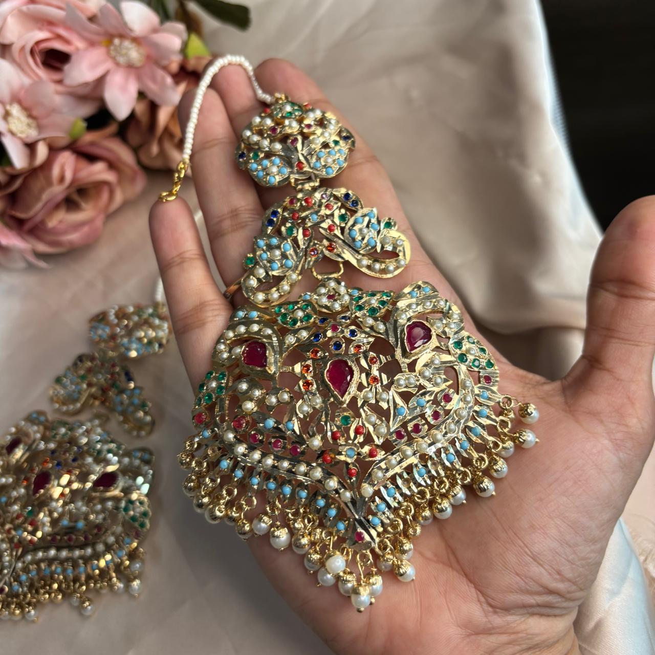 Handcrafted gold plated Jadau ear climber Kannauti earrings with pearl drops and multicolour stones by Bebaak Jewels.