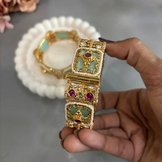 Handheld mint green rajwada kada with ruby and kundan in gold plating 