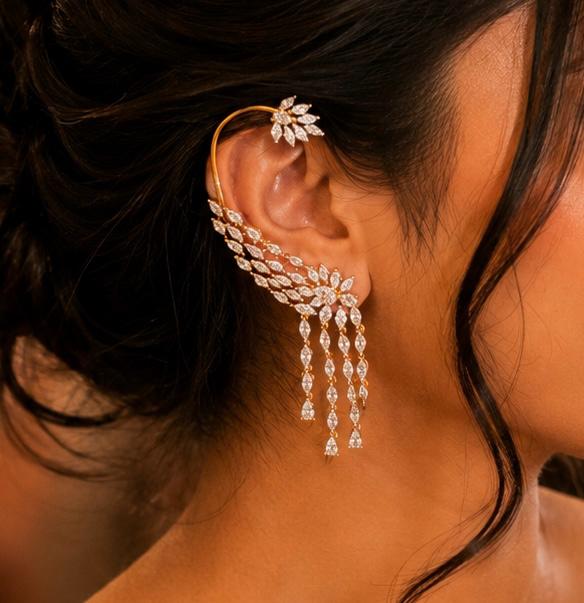 Woman wearing Celeste marquise American Diamond statement ear cuff with cascading stone dangles