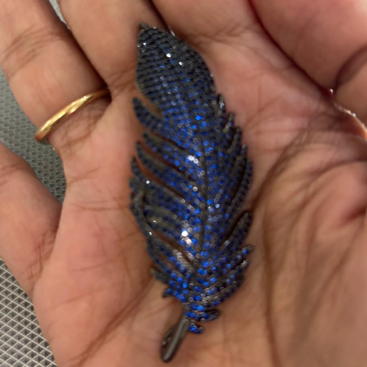 Luxury midnight blue crystal feather brooch with black rhodium finish for saree blazer coat dress and scarf styling by Bebaak Jewels