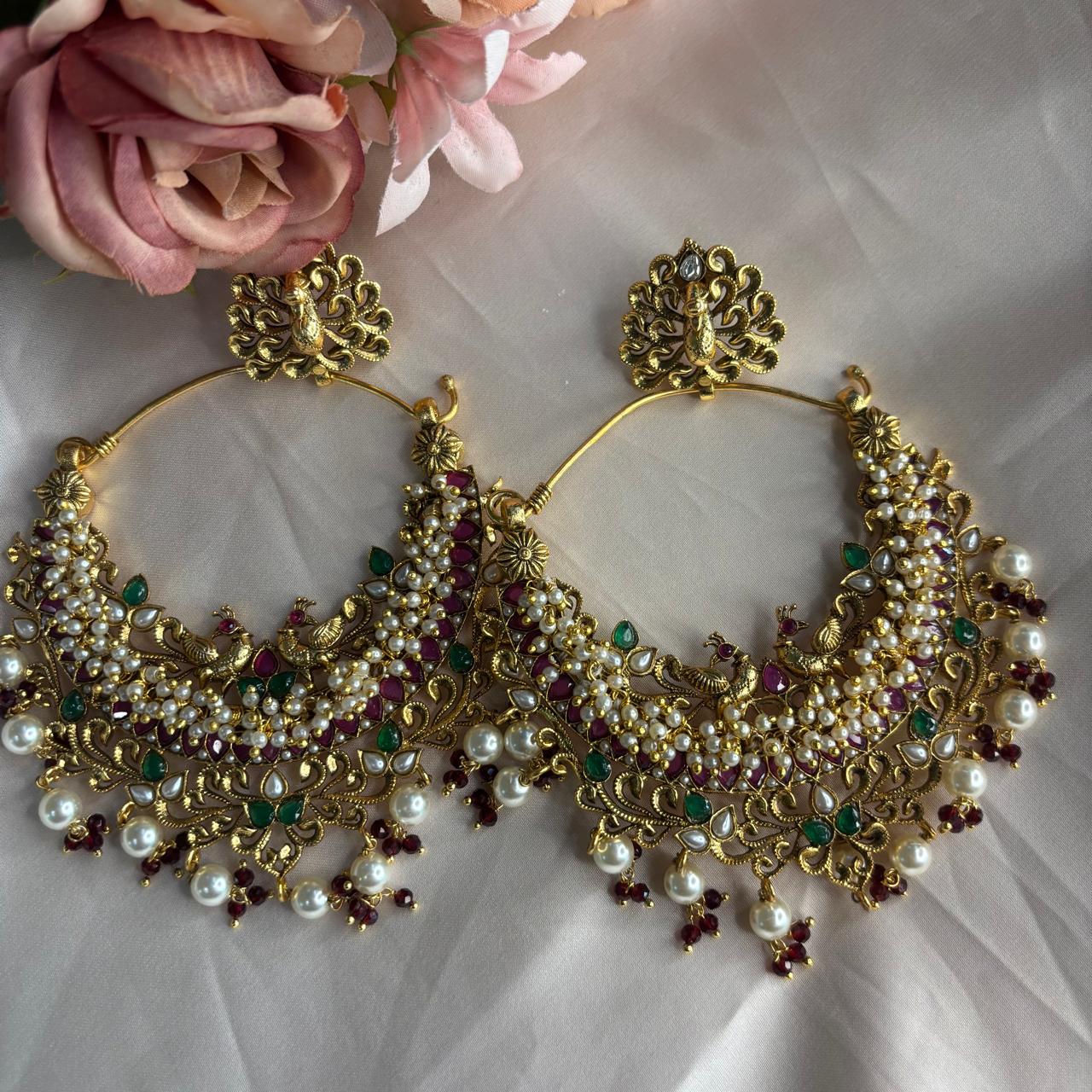 Handcrafted Peacock Chandbali earrings with ruby stones, emerald accents and pearls
