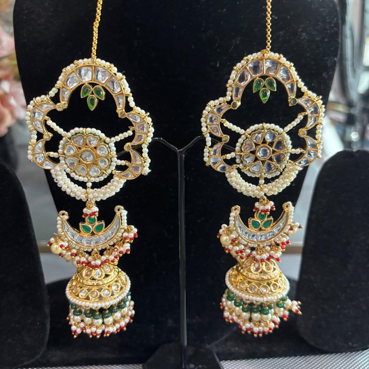 Close up of Lightweight Big floral kundan earcuff earrings with pearl detailing and jhumka drop