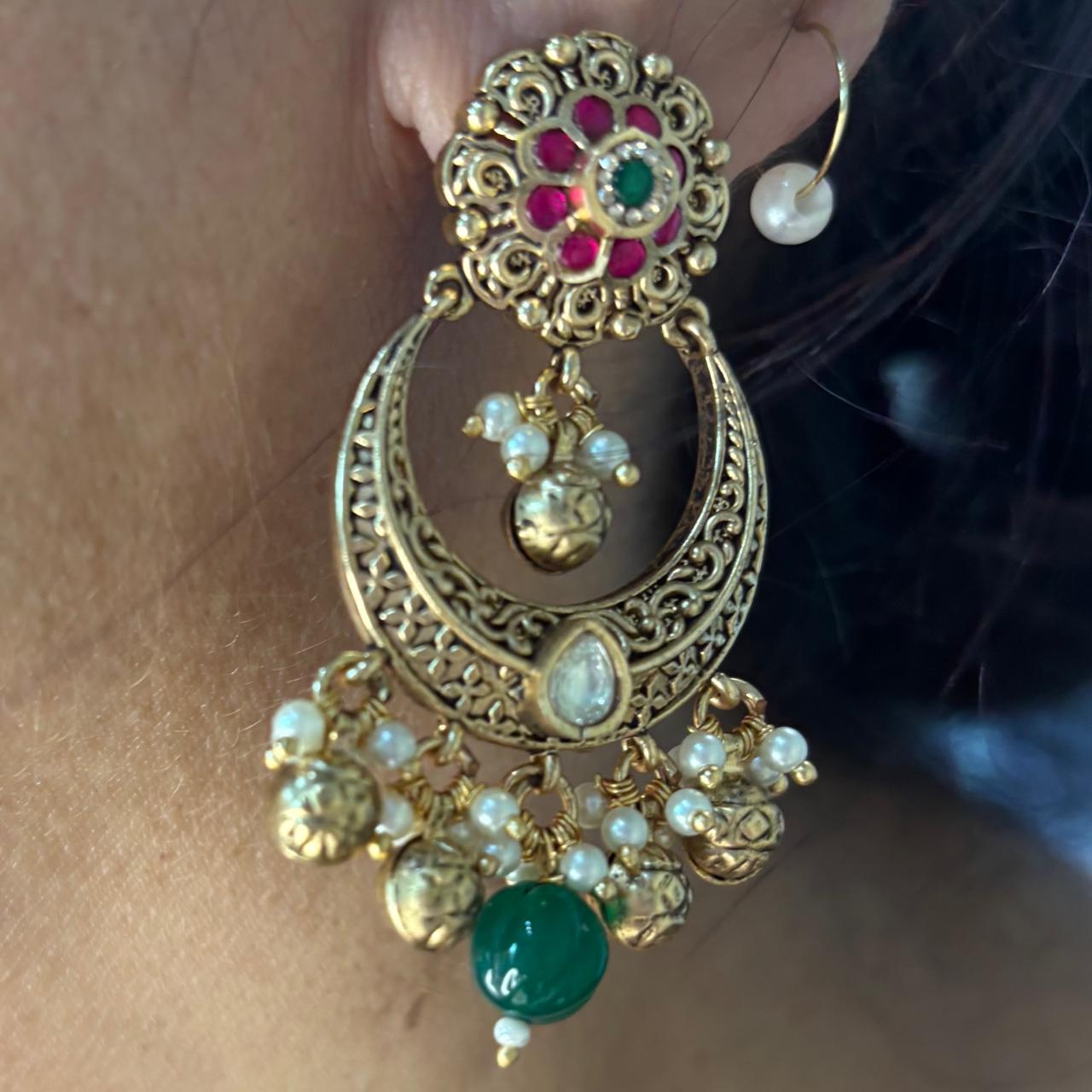 Rajwadi Kundan pearl  long necklace set with antique gold finish, multi-layer pearl strands, ruby accents, emerald green bead drops and matching chandbali earrings.
