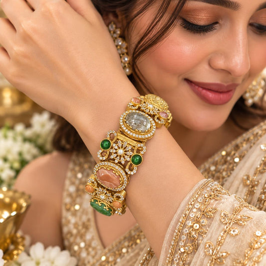  Woman wearing Sabya multistone openable kada bracelet with colourful stones and crystal detailing
