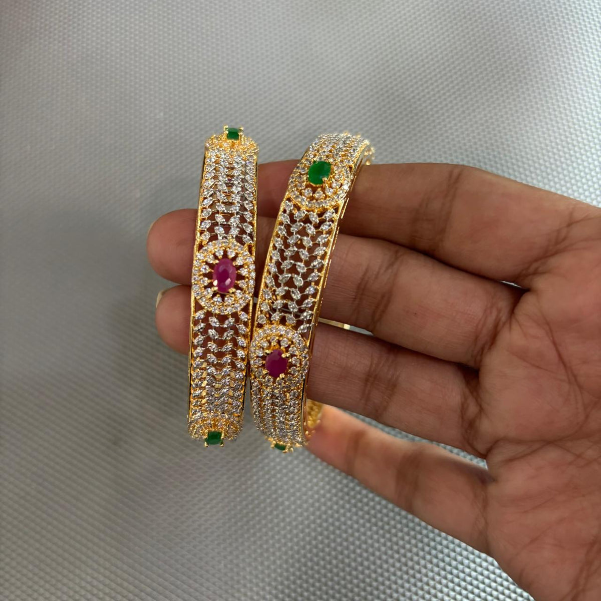 Pair of  ruby emerald american diamonds gold tone Bangles 

