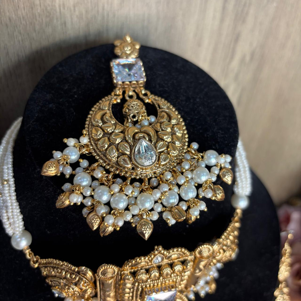Close up view of Antique gold bridal maang tikka