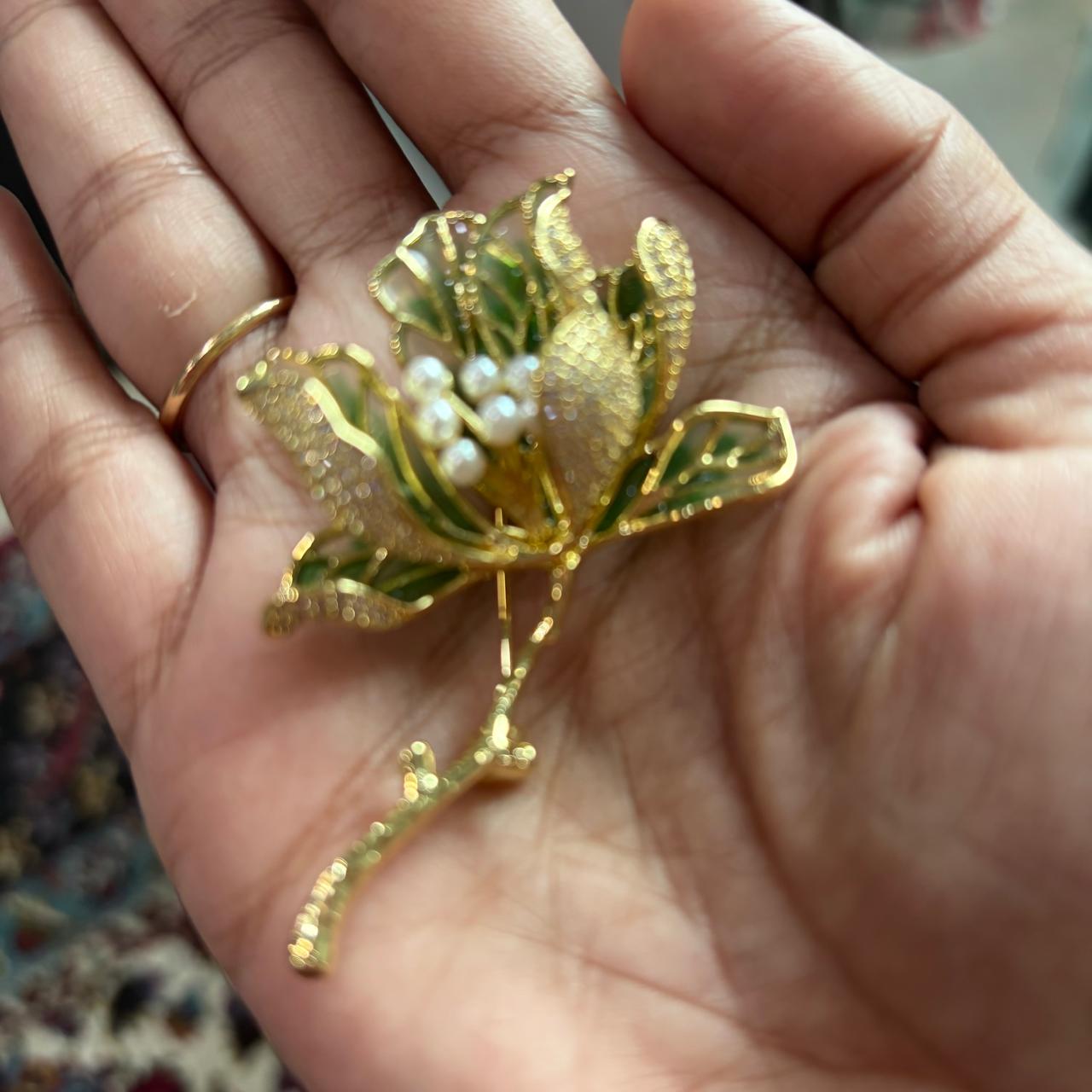 Luxury gold plated tulip floral brooch pin with CZ diamonds, pearls and green enamel leaves for saree, blazer, men’s kurta, doctor coat and lawyer coat