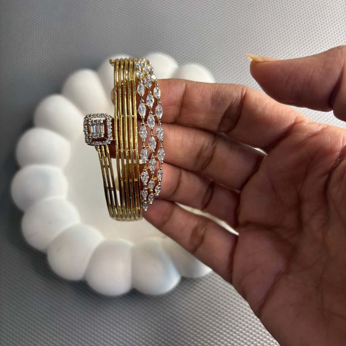 Close-up of Anshi bracelet showing marquise CZ stones and slender gold-plated bands