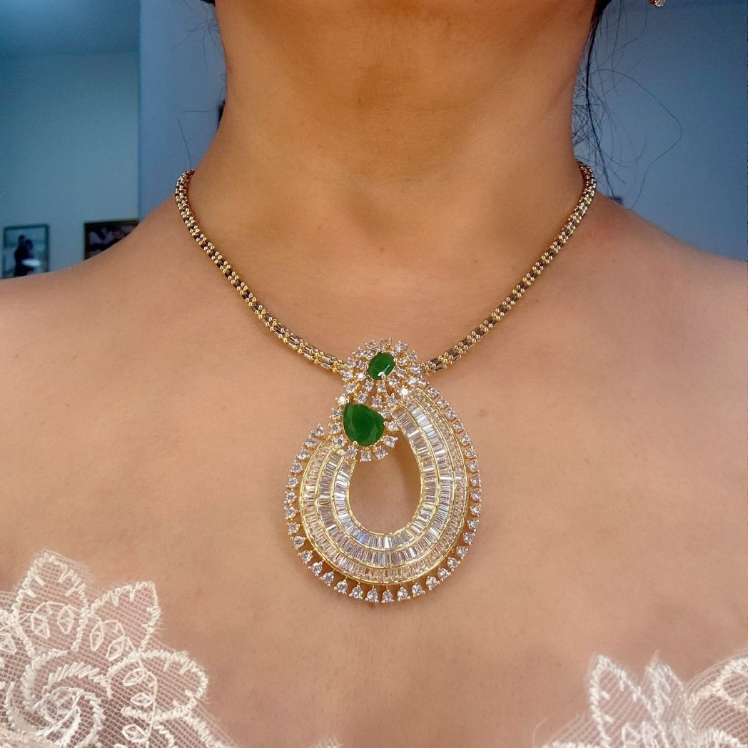  rich baguette cut stones and diamond and emerald pendant set in gold plating