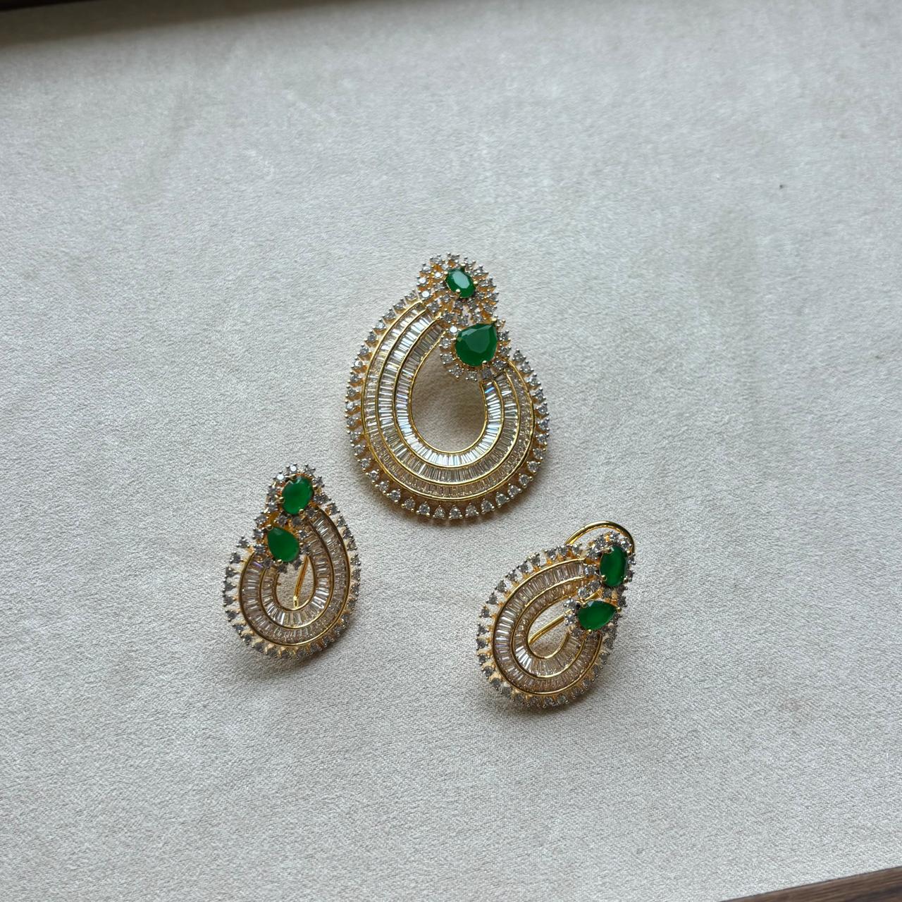  rich baguette cut stones and diamond and emerald pendant set in gold plating