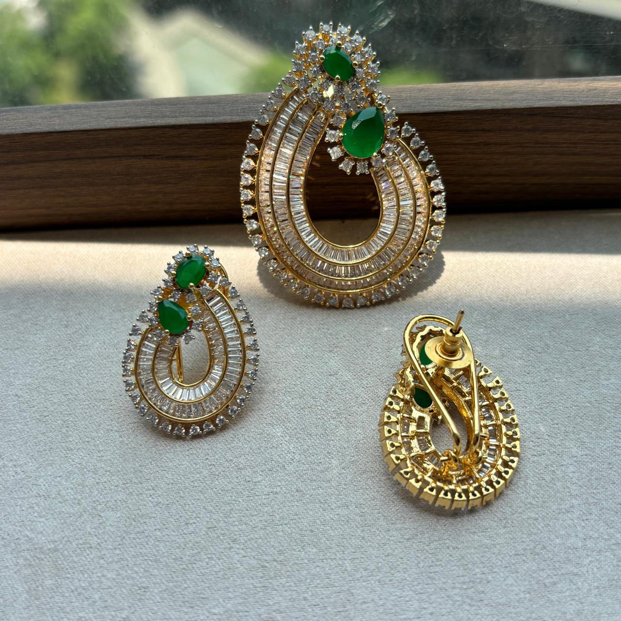  rich baguette cut stones and diamond and emerald pendant set in gold plating