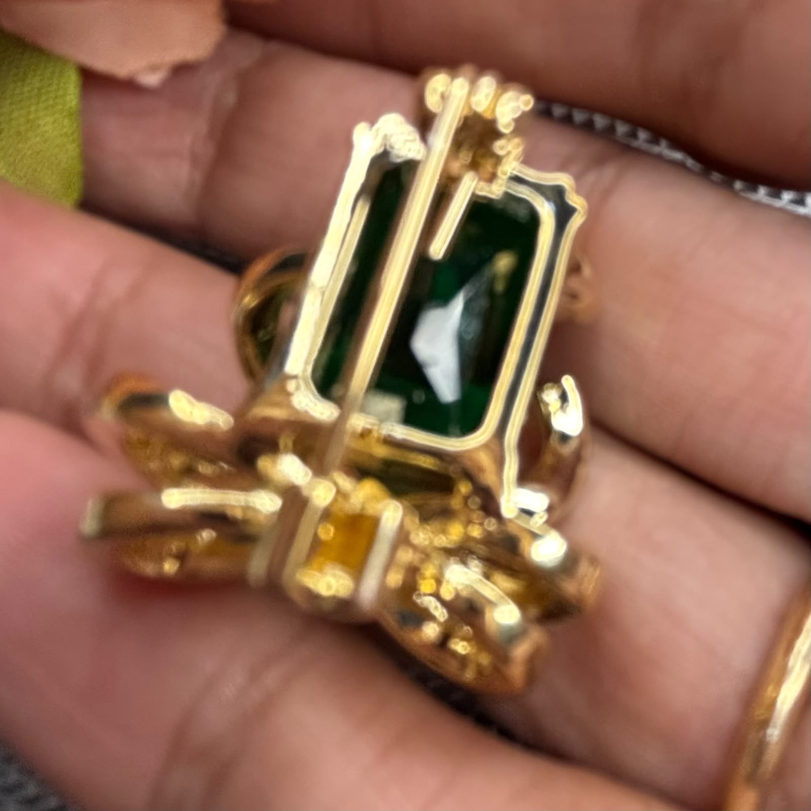 Emerald green crystal bow brooch pin with gold finish and sparkling cubic zirconia stones for sarees blazers coats dresses by Bebaak Jewels
