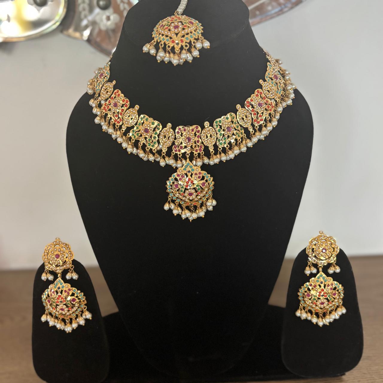 Bride wearing jadau multistone pearls royal Bridal necklace  set