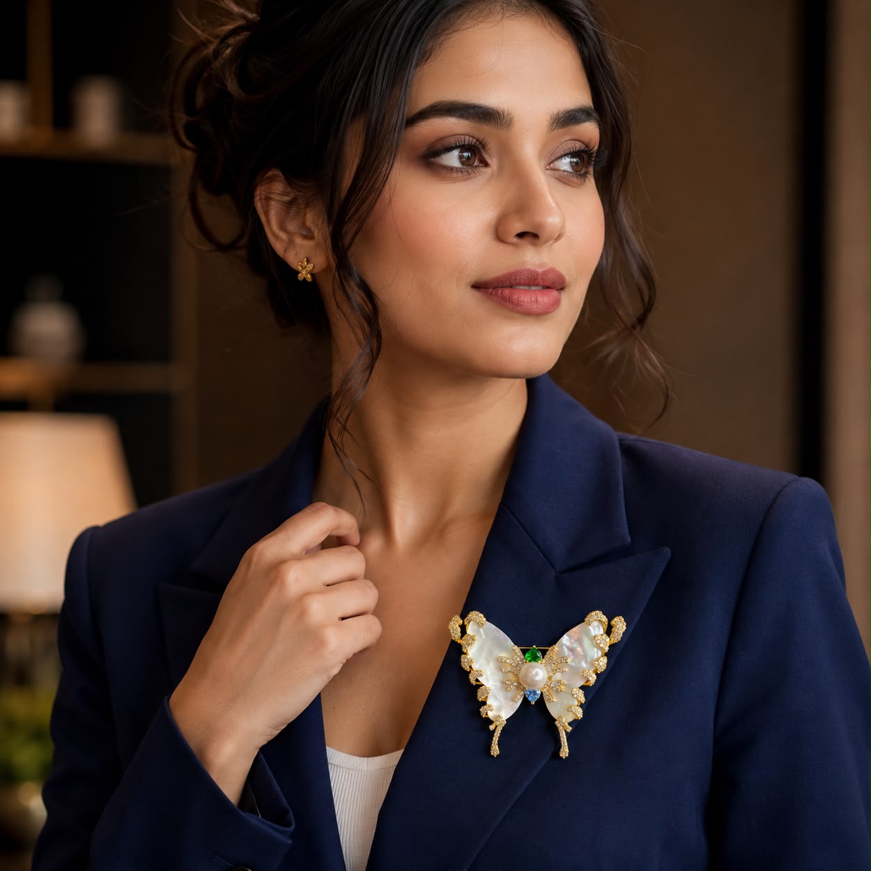 Luxury Mother of Pearl Butterfly Brooch with CZ diamonds detailing, pearl center and gold finish for sarees, blazers, dresses and scarves.