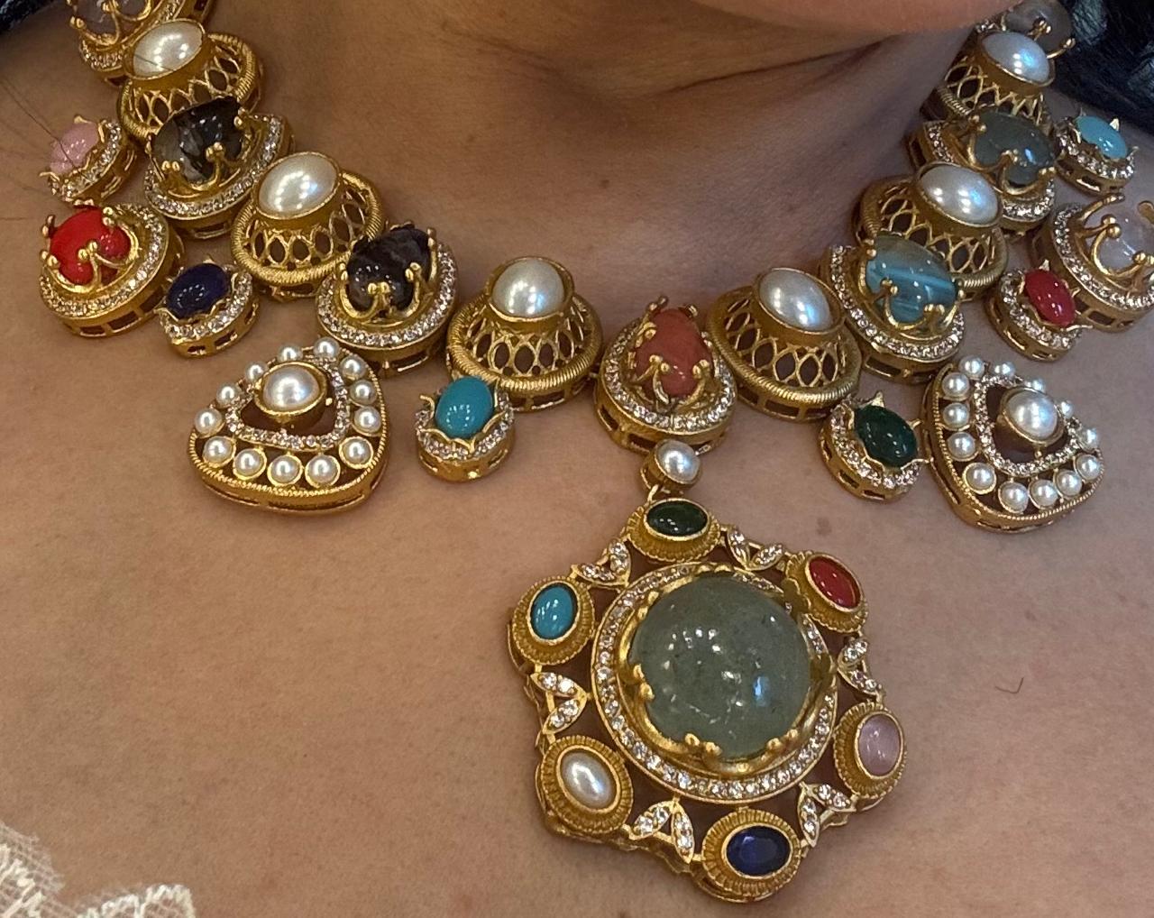 multi stones ,pearls and american diamond in an indo western necklace set with earrings