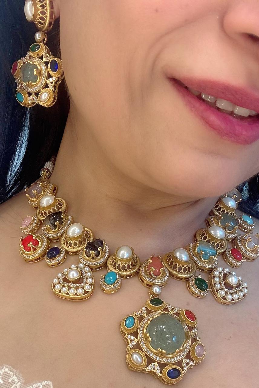 multi stones ,pearls and american diamond in an indo western necklace set with earrings
