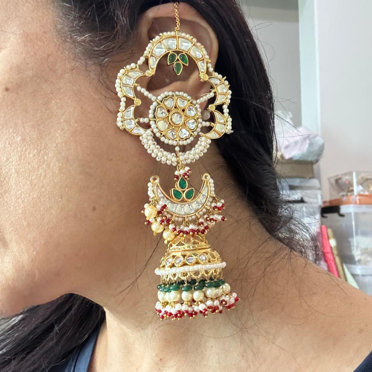  Close up view of Women wearing Lightweight Big floral kundan earcuff earrings with pearl detailing and jhumka drop