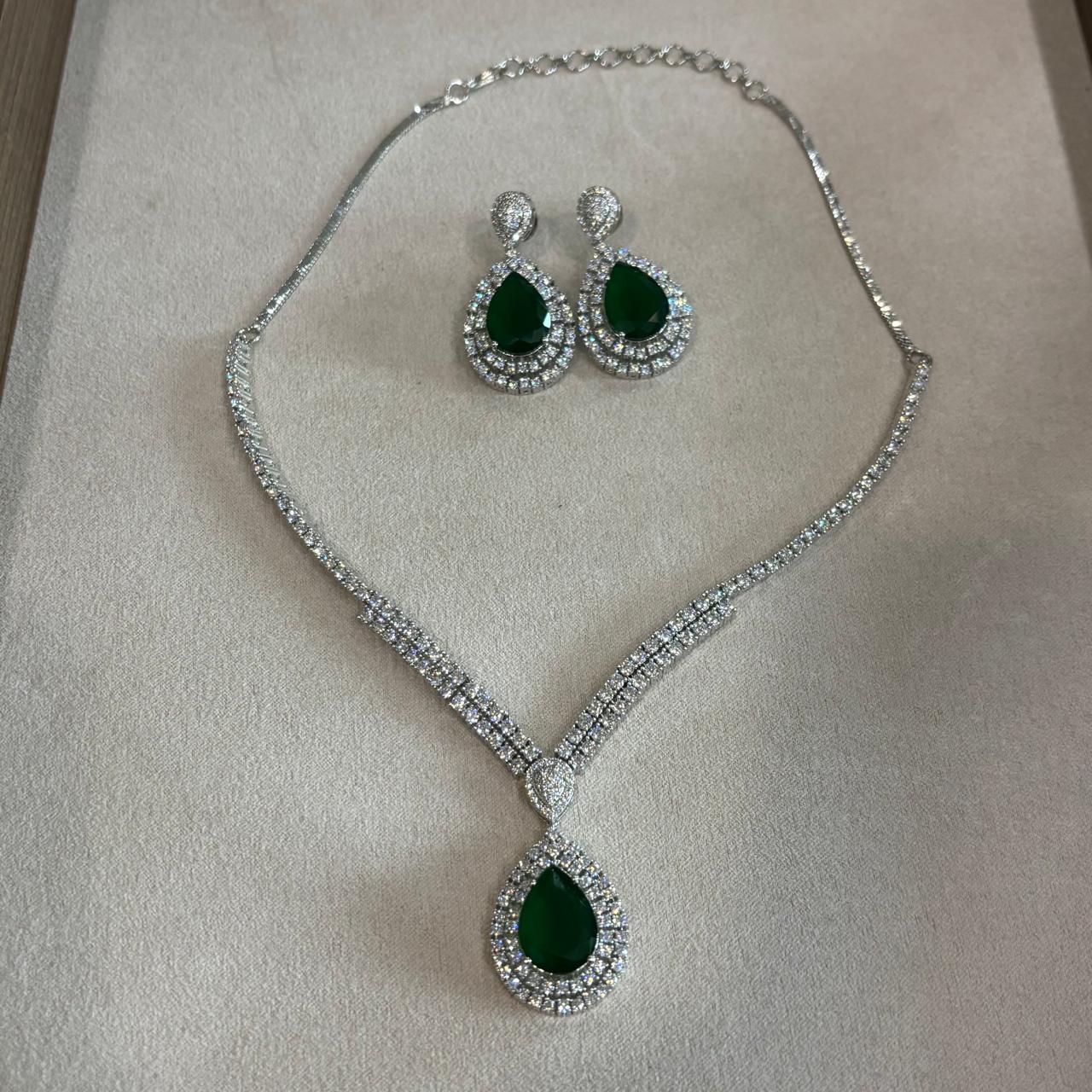 sophisticated american diamond  necklace set with emerald stone pendant  and  matching earrings