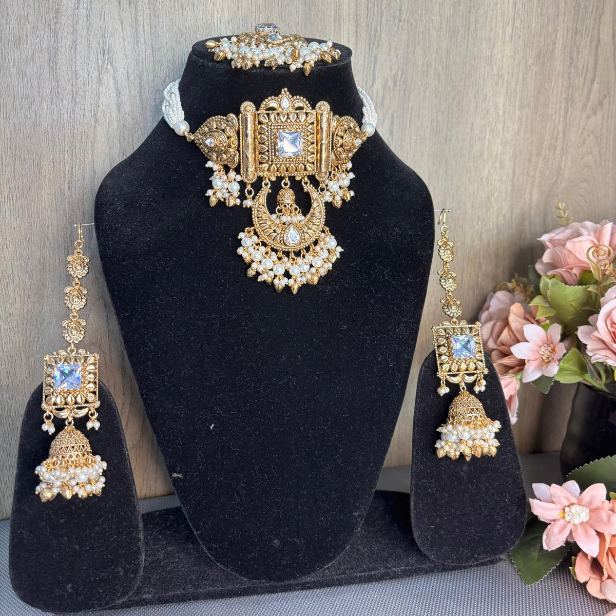 Full view of  Antique gold bridal choker necklace set with white pearl strands kannauti jhumka earrings and maang tikka