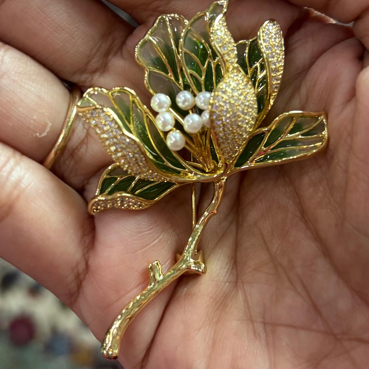 Luxury gold plated tulip floral brooch pin with CZ diamonds, pearls and green enamel leaves for saree, blazer, men’s kurta, doctor coat and lawyer coat