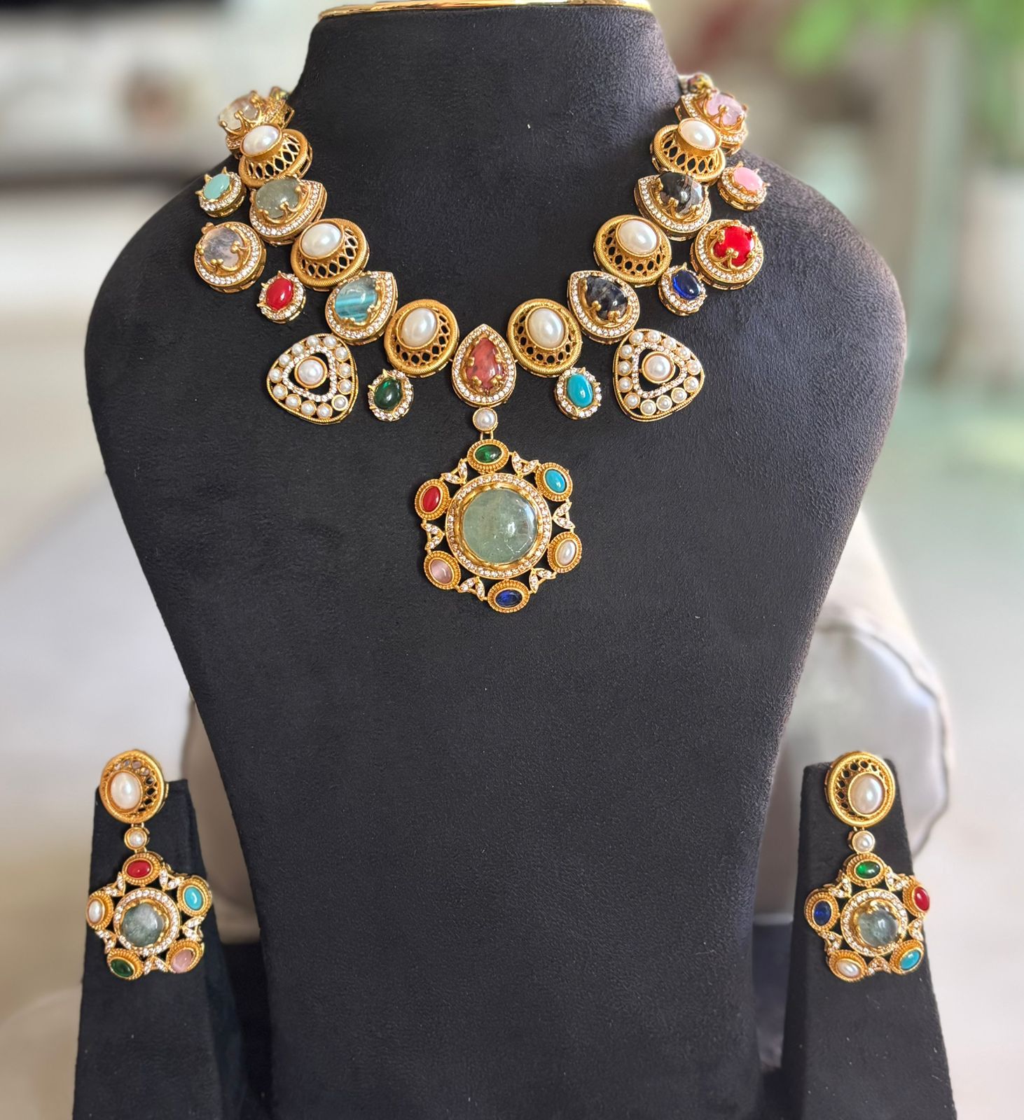 multi stones ,pearls and american diamond in an indo western necklace set with earrings